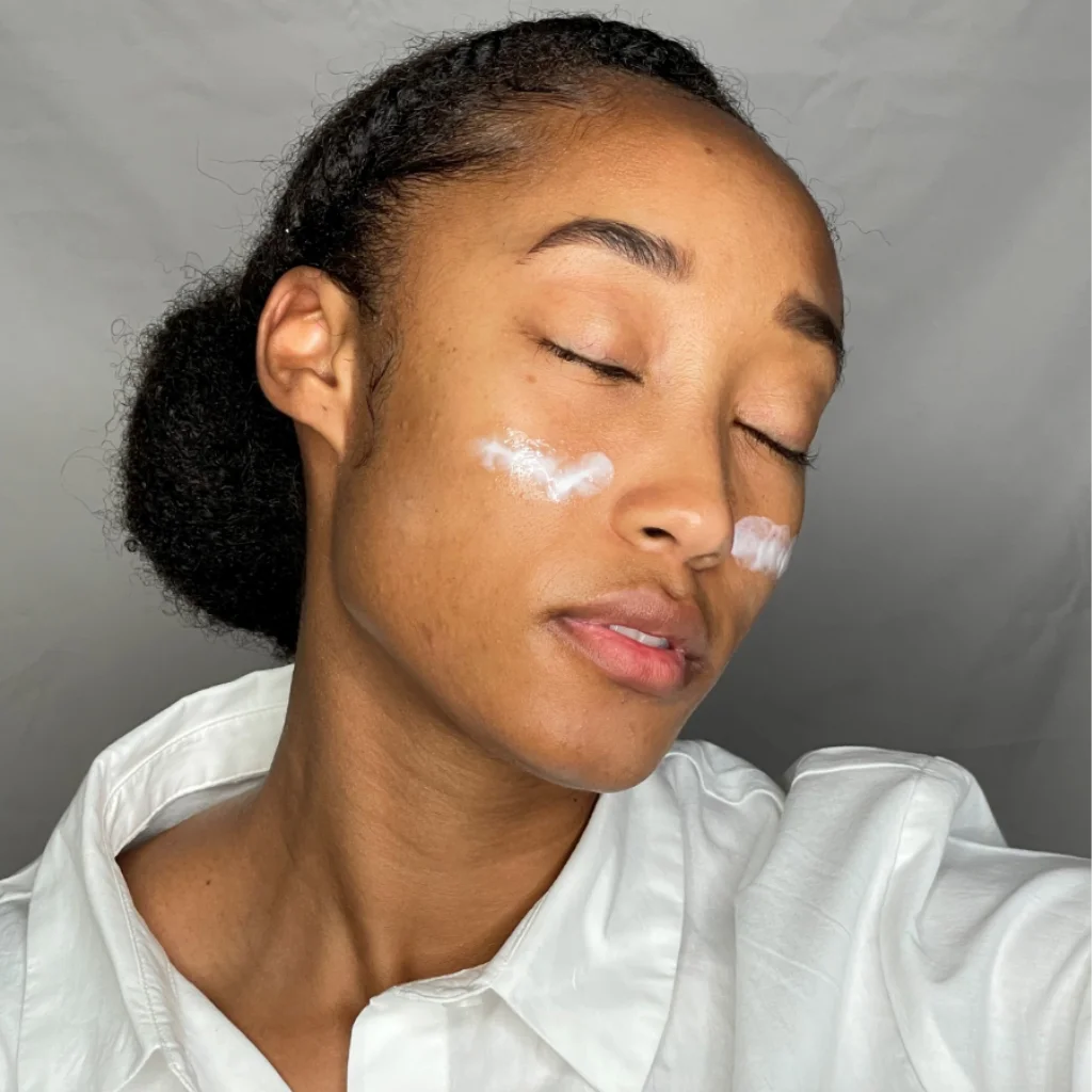 Applying RE-JUV Skin Vitamin C Creme